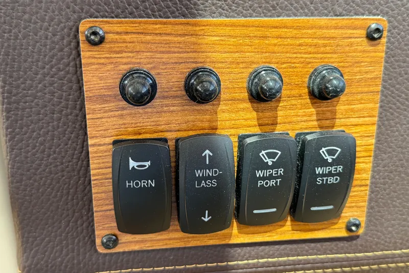  Yacht Photos Pics Control panel of 2025 Ranger Tugs R-23 boat with horn and wiper switches.