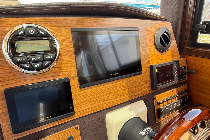  Yacht Photos Pics 2025 Ranger Tugs R-23 dashboard with Garmin displays and control panel.