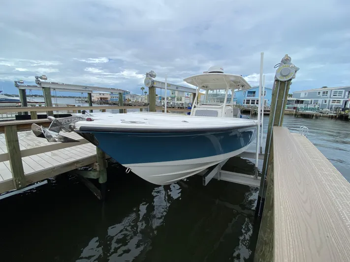  Yacht Photos Pics 2007 Edgewater 318CC boat docked at a marina under a cloudy sky.