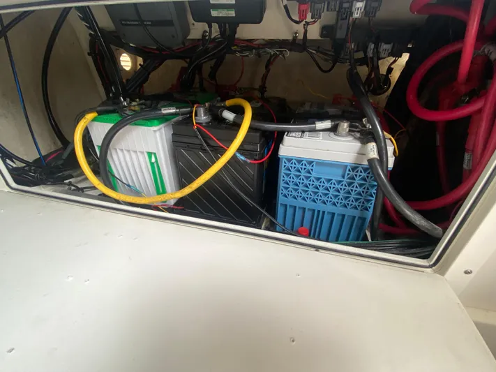  Yacht Photos Pics Battery compartment of a 2007 Edgewater 318CC boat, showing wiring and connections.