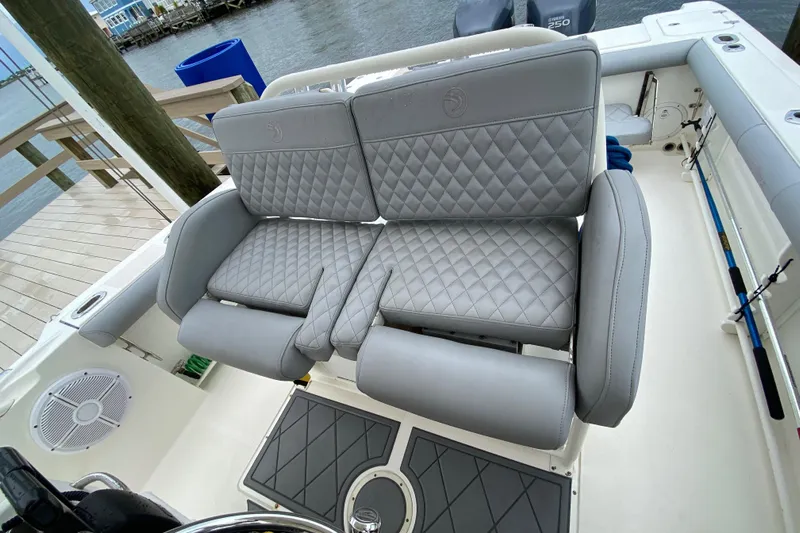  Yacht Photos Pics Luxurious seating on 2007 Edgewater 318CC boat with quilted gray upholstery.