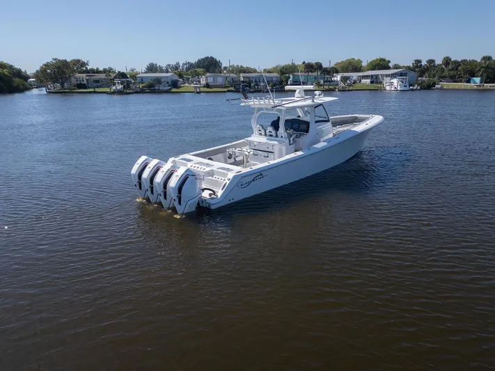 Grey Goose Yacht Photos Pics 2020 Blackwater 43 Sportfish boat with four engines on a calm river.