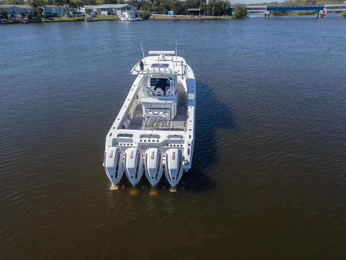 Grey Goose Yacht Photos Pics 2020 Blackwater 43 Sportfish boat with four engines on a calm river.