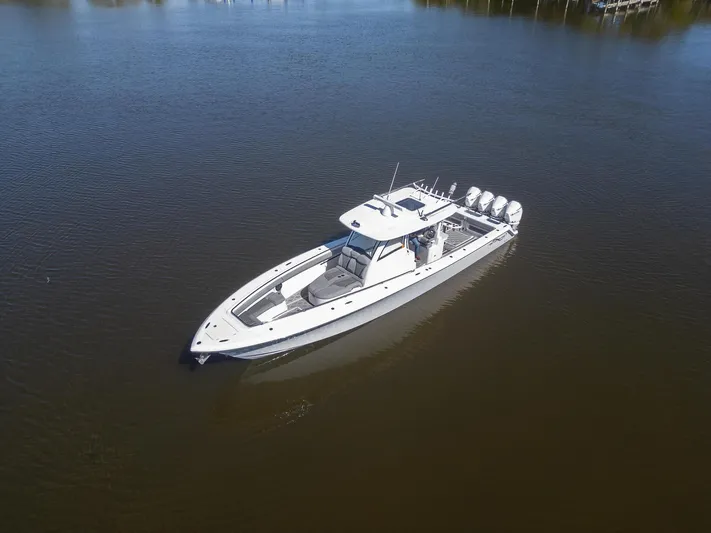 Grey Goose Yacht Photos Pics 2020 Blackwater 43 Sportfish boat on calm water, aerial view.