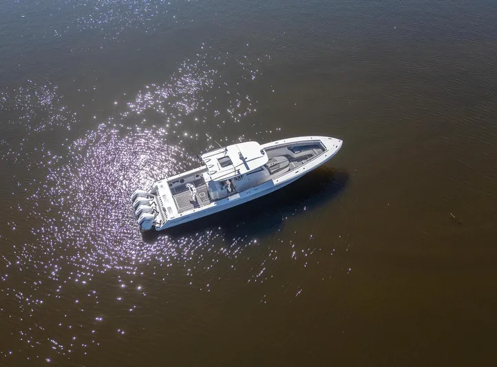 Grey Goose Yacht Photos Pics Aerial view of 2020 Blackwater 43 Sportfish boat on shimmering water.