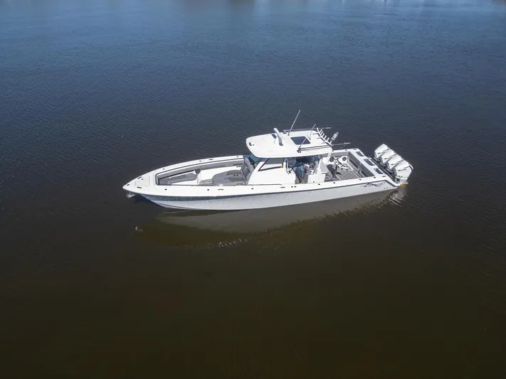 Grey Goose Yacht Photos Pics 2020 Blackwater 43 Sportfish boat on calm water, aerial view.