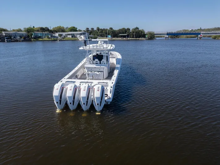 Grey Goose Yacht Photos Pics 2020 Blackwater 43 Sportfish boat with four engines on calm water.