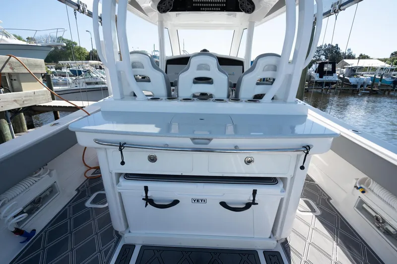 Grey Goose Yacht Photos Pics 2020 Blackwater 43 Sportfish boat interior with seating and storage, docked at marina.