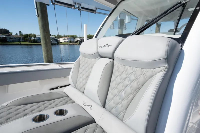 Grey Goose Yacht Photos Pics Luxury seating on 2020 Blackwater 43 Sportfish boat with quilted design and cup holders.