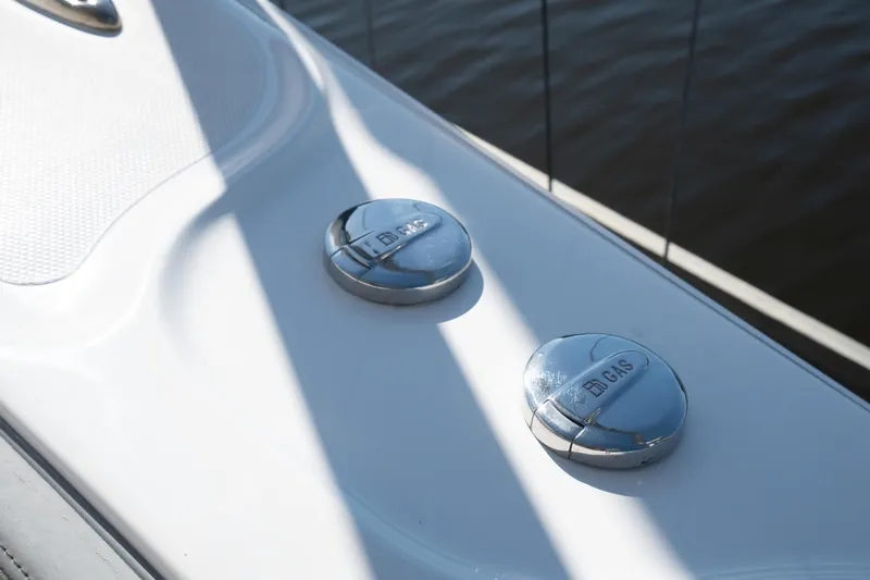 Grey Goose Yacht Photos Pics Fuel caps on 2020 Blackwater 43 Sportfish boat deck, sunlight reflecting on water.
