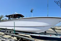 2025 Catamaran 47 Offshore on trailer, displayed outdoors under clear blue sky.