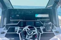 2025 Catamaran 47 Offshore Catamaran helm with advanced navigation displays on open sea.