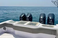 2025 Catamaran 47 Offshore with four Mercury outboard engines on open sea.