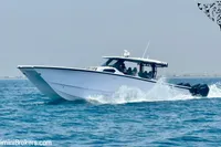 2025 Catamaran 47 Offshore cruising on open water, showcasing sleek design and powerful performance.