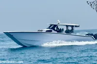 2025 Catamaran 47 Offshore cruising on open water, showcasing sleek design and powerful engines.