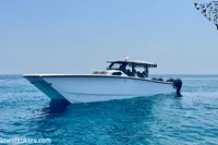 2025 Catamaran 47 Offshore cruising on clear blue ocean waters.