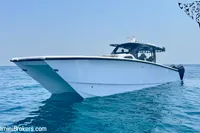 2025 Catamaran 47 Offshore cruising on calm blue waters.