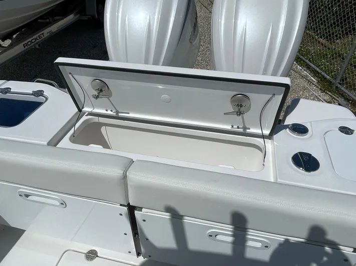 Ice Blue Yacht Photos Pics 2024 Everglades 285CC boat with open storage compartment and dual engines.