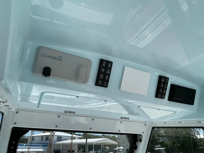 Ice Blue Yacht Photos Pics 2024 Everglades 285CC boat dashboard with Garmin electronics and control panels.