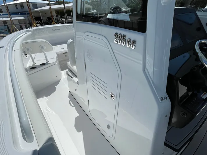 Ice Blue Yacht Photos Pics 2024 Everglades 285CC boat, white interior, sleek design, modern console, spacious seating.