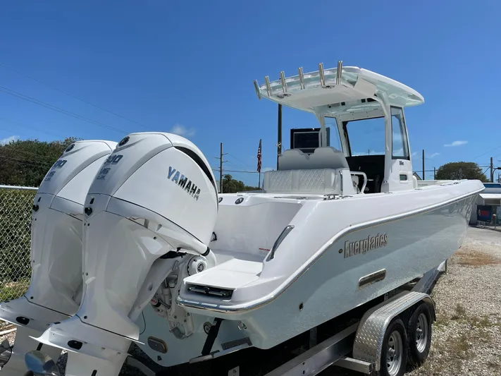 Ice Blue Yacht Photos Pics 2024 Everglades 285CC boat with dual Yamaha engines on a trailer.
