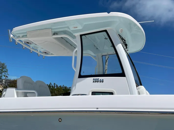 Ice Blue Yacht Photos Pics 2024 Everglades 285CC boat with sleek design and modern features under a clear blue sky.