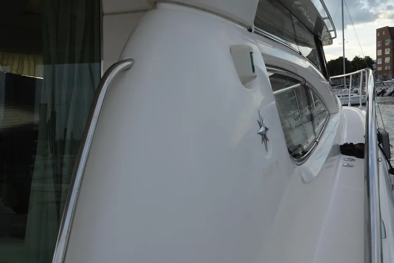 Piper Yacht Photos Pics 2007 Jeanneau Prestige 46 yacht side view with sleek design and marina background.