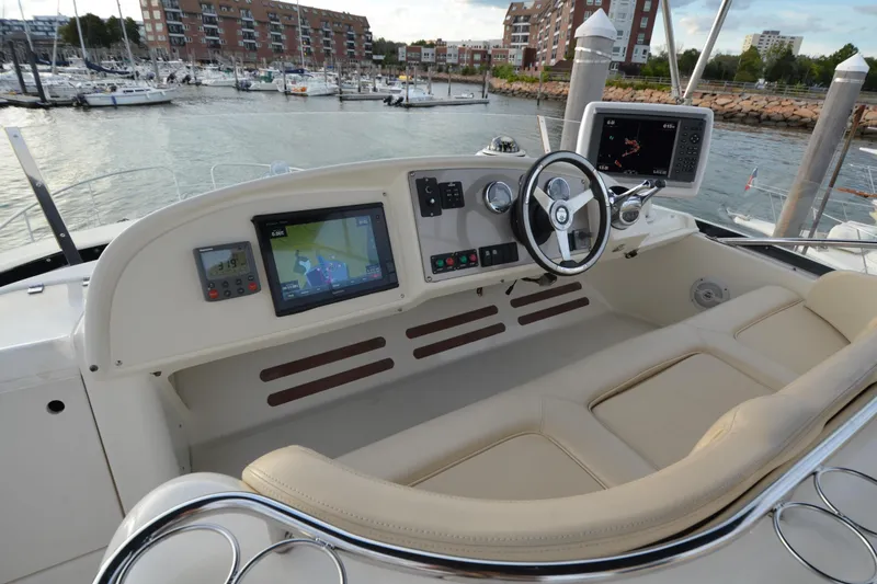 Piper Yacht Photos Pics Helm of 2007 Jeanneau Prestige 46 yacht with navigation screens and steering wheel.