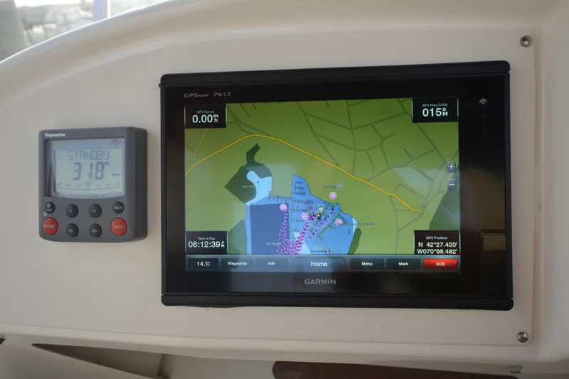 Piper Yacht Photos Pics Garmin GPS and Raymarine display on 2007 Jeanneau Prestige 46 yacht dashboard.
