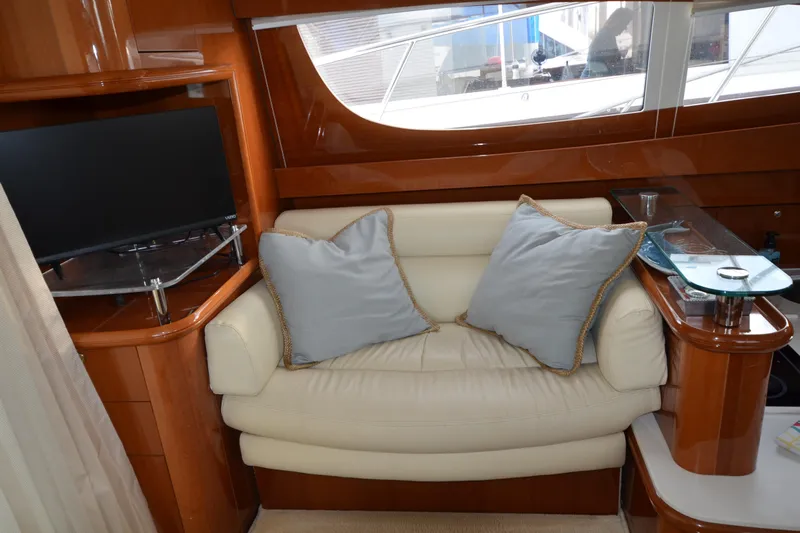 Piper Yacht Photos Pics Luxurious interior of 2007 Jeanneau Prestige 46 yacht with cozy seating and modern TV.