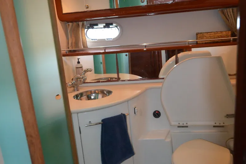 Piper Yacht Photos Pics Bathroom interior of 2007 Jeanneau Prestige 46 yacht with sink and toilet.
