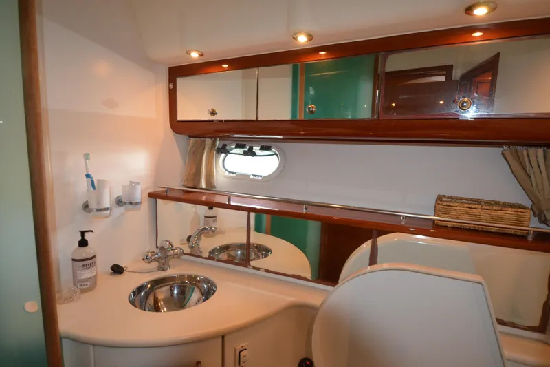 Piper Yacht Photos Pics Luxurious bathroom in 2007 Jeanneau Prestige 46 yacht with modern fixtures and ample storage.