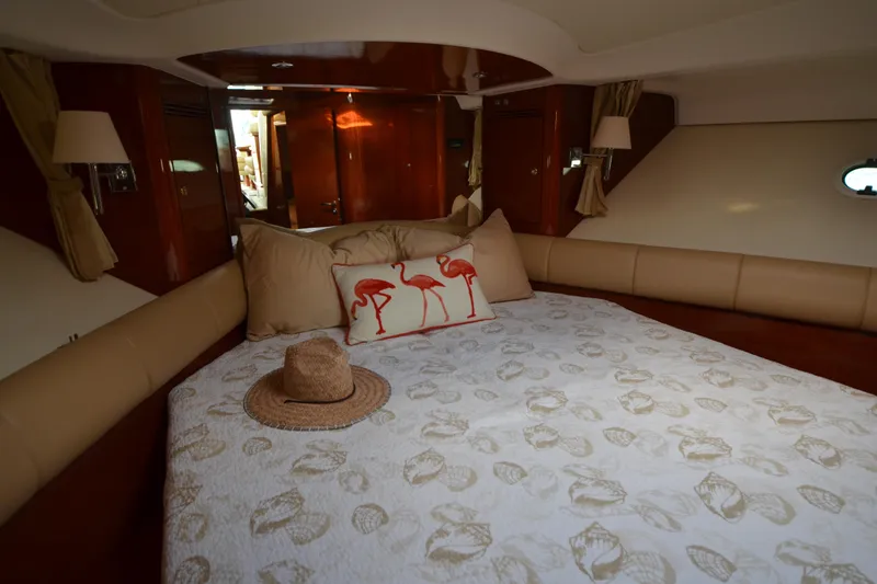 Piper Yacht Photos Pics Luxurious cabin interior of 2007 Jeanneau Prestige 46 yacht with elegant bedding and decor.