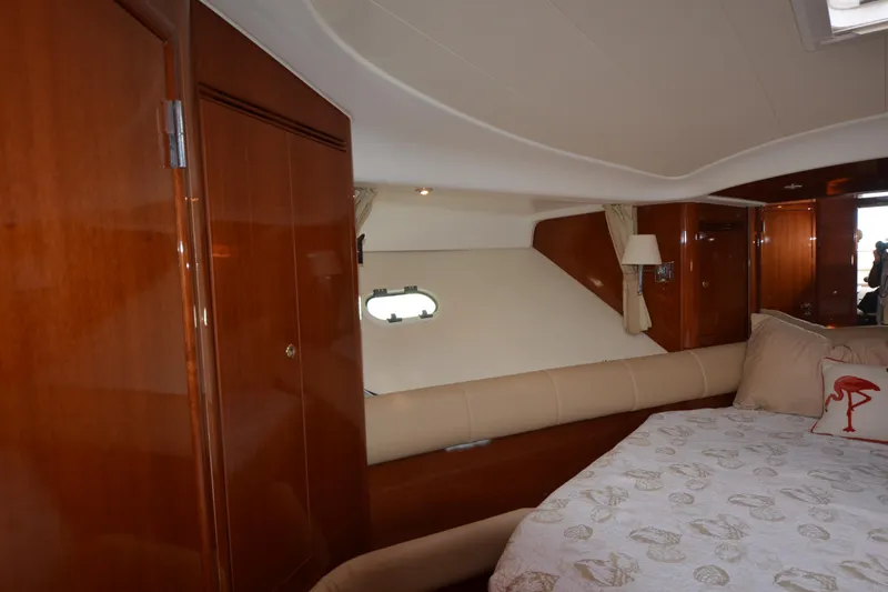 Piper Yacht Photos Pics Luxurious cabin interior of 2007 Jeanneau Prestige 46 yacht with elegant wood finish.