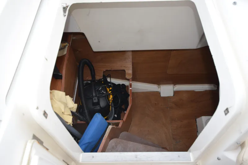 Piper Yacht Photos Pics Storage compartment inside a 2007 Jeanneau Prestige 46 yacht, featuring various equipment.