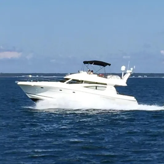 Piper Yacht Photos Pics 2007 Jeanneau Prestige 46 yacht cruising on open water under clear skies.