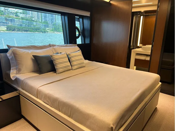 Hk 007 Yacht Photos Pics Luxurious bedroom interior of 2024 Riva 102' Corsaro Super yacht with waterfront view.