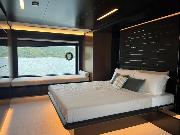 Hk 007 Yacht Photos Pics Luxurious bedroom interior of 2024 Riva 102' Corsaro Super yacht with scenic ocean view.