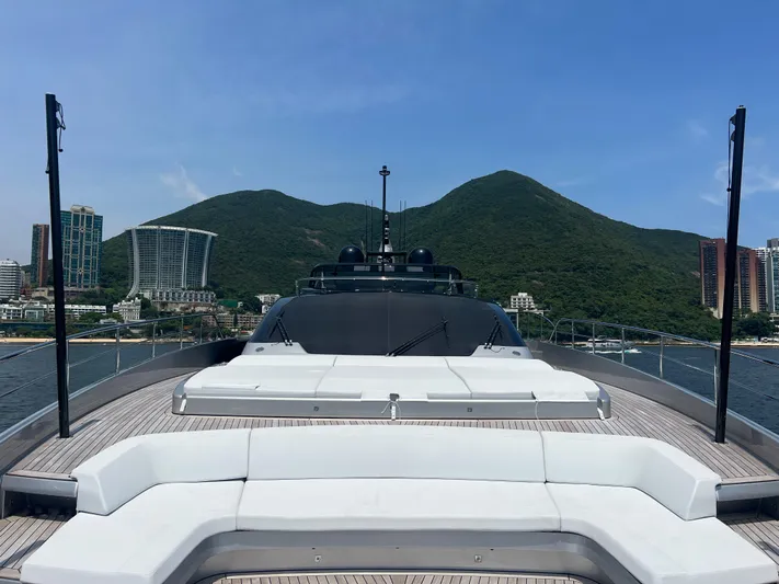 Hk 007 Yacht Photos Pics 2024 Riva 102' Corsaro Super yacht with scenic mountain and city backdrop.