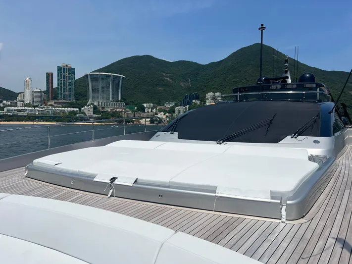 Hk 007 Yacht Photos Pics 2024 Riva 102' Corsaro Super yacht with cityscape and mountains in the background.