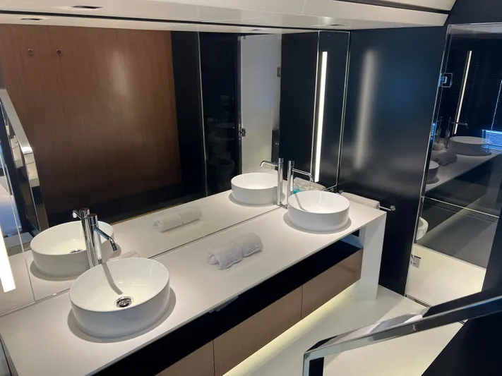 Hk 007 Yacht Photos Pics Luxurious bathroom interior of 2024 Riva 102' Corsaro Super yacht with modern fixtures.