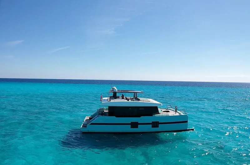 Rockstar 2.0 Yacht Photos Pics Sunreef 68 Supreme yacht cruising on clear blue ocean, 2018 model.