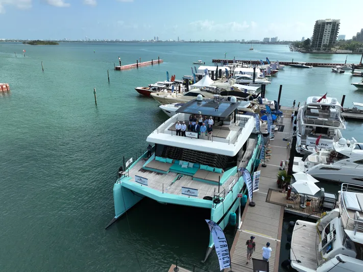 Rockstar 2.0 Yacht Photos Pics Sunreef 68 Supreme 2018 yacht docked at marina with people on deck.