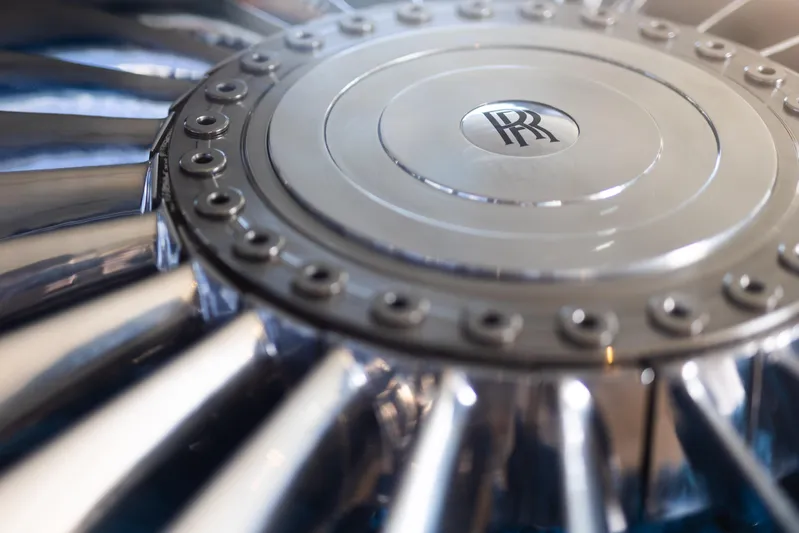 Rockstar 2.0 Yacht Photos Pics Close-up of a Rolls-Royce engine turbine detail, showcasing metallic blades and logo.