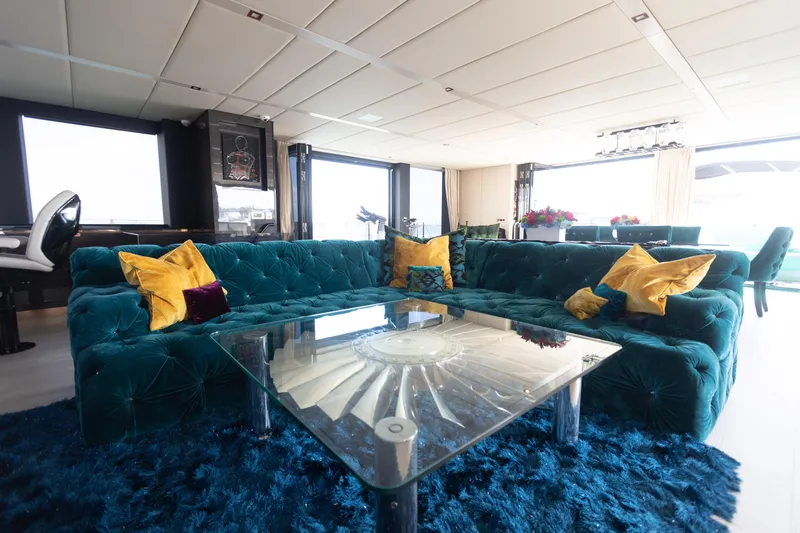 Rockstar 2.0 Yacht Photos Pics Luxurious interior of 2018 Sunreef 68 Supreme yacht with plush seating and vibrant decor.