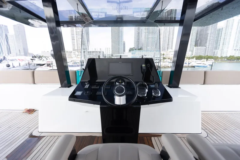 Rockstar 2.0 Yacht Photos Pics Helm of 2018 Sunreef 68 Supreme yacht with city skyline in background.