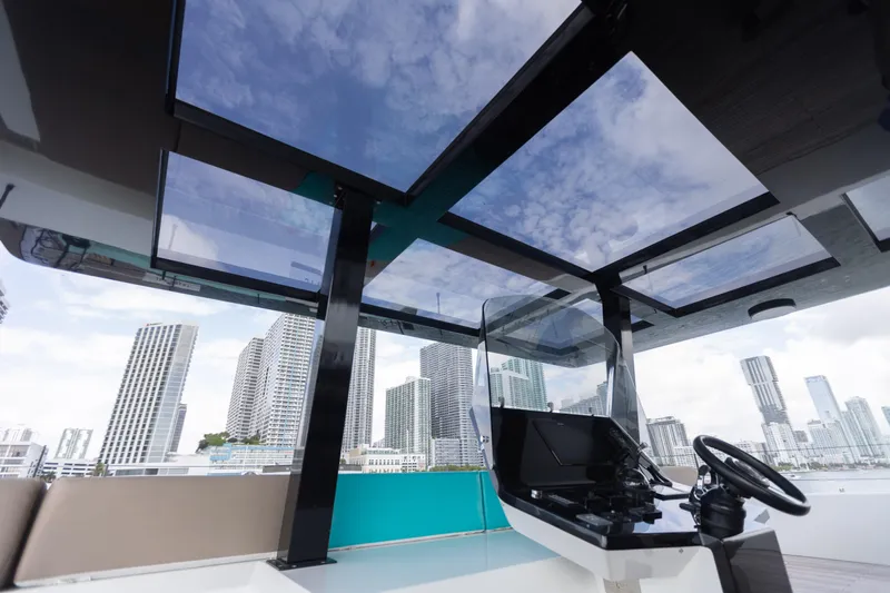 Rockstar 2.0 Yacht Photos Pics Luxurious Sunreef 68 Supreme yacht helm with city skyline view, 2018 model.