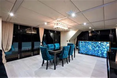 Rockstar 2.0 Yacht Photos Pics Luxurious interior of 2018 Sunreef 68 Supreme yacht with elegant dining area and modern decor.