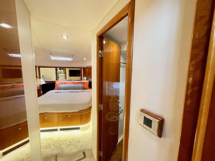 Ellyn Yacht Photos Pics Luxurious bedroom interior of 2010 Sunseeker Manhattan 70 yacht with modern furnishings.