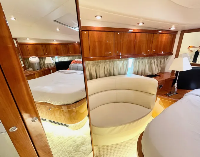 Ellyn Yacht Photos Pics Luxurious interior of 2010 Sunseeker Manhattan 70 yacht with elegant wood finishes.